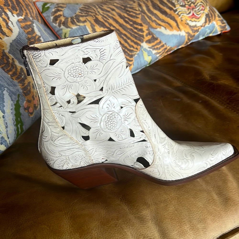 Beautiful cut and topped cream leather boots with stacked heel. Worn once.
